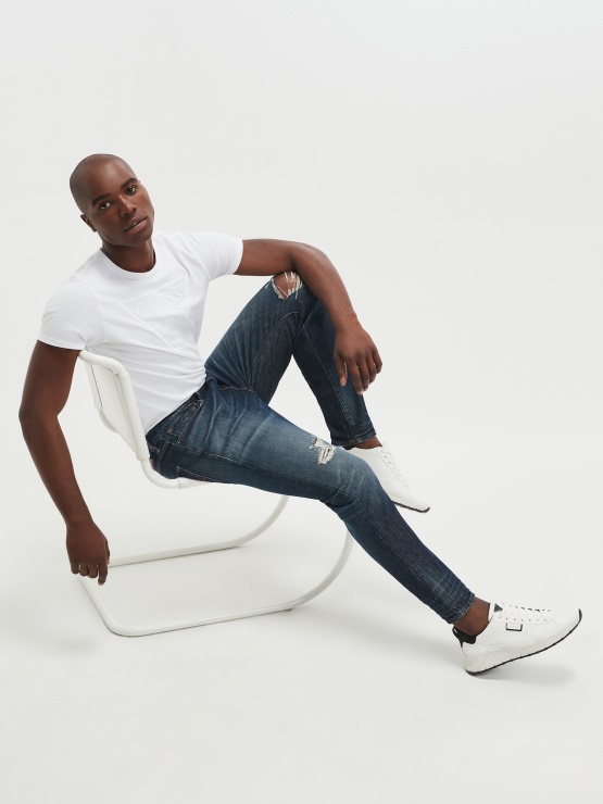 Globetrotter Guess Distressed Sproščene Zožene Kavbojke